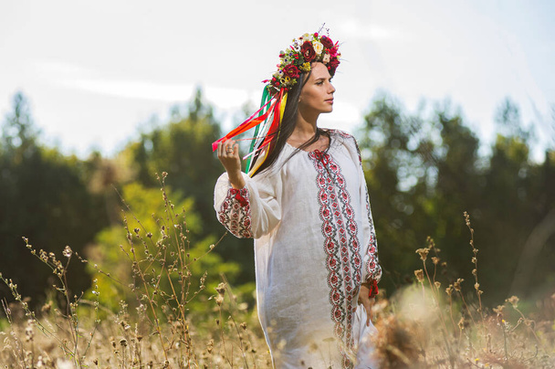 Outdoor portrait of beautiful pregnant Ukrainian woman. - Photo, Image
