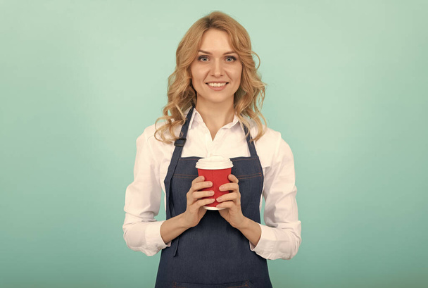 Spirit of Expertise. cheerful girl drinking tea. woman in apron with plastic cup. good morning - Φωτογραφία, εικόνα