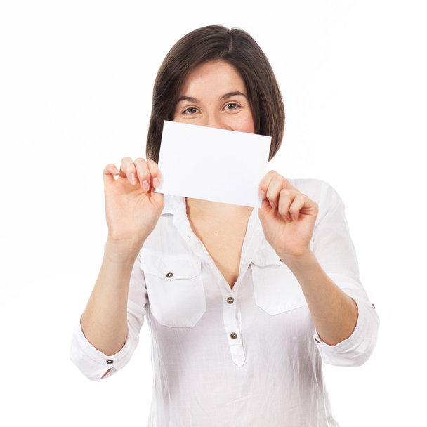 Beautiful young woman showing a blank business card - Fotó, kép