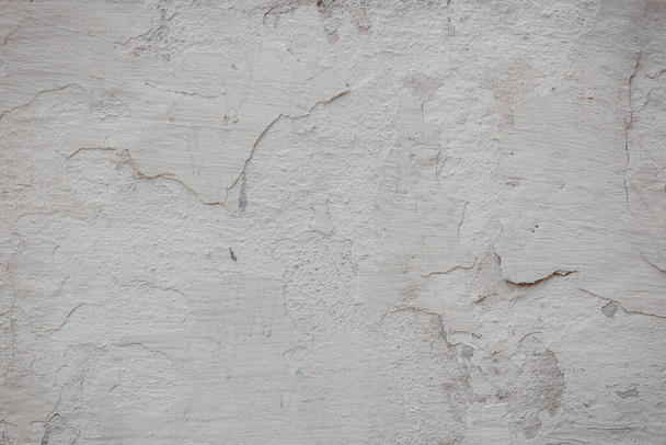 текстура старой стены с трещинами и царапинами, которые могут быть использованы в качестве фона - Фото, изображение