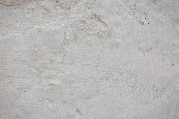 texture of concrete wall with cracks and scratches which can be used as a background - Φωτογραφία, εικόνα
