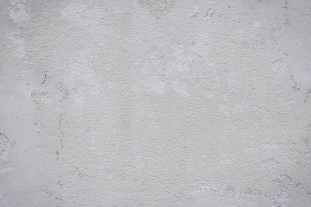 текстура старой бетонной стены с трещинами и царапинами, которые могут быть использованы в качестве фона - Фото, изображение