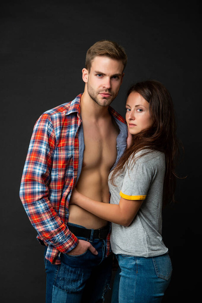 sexy young couple in love on black background, love - 写真・画像