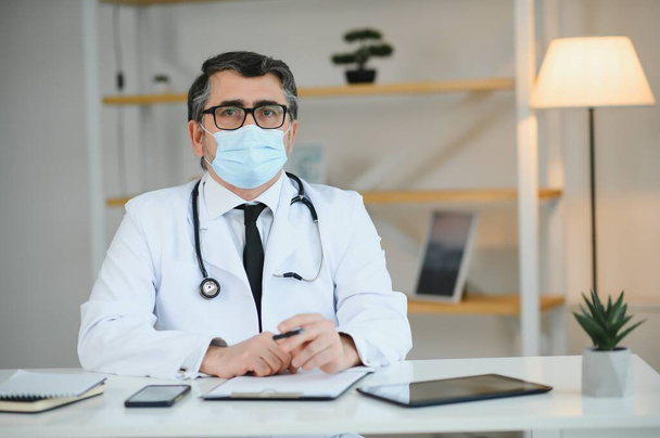 Doctor Puts on Gloves and Wearing Medical Mask. Medical Concept Corona Virus - Foto, imagen