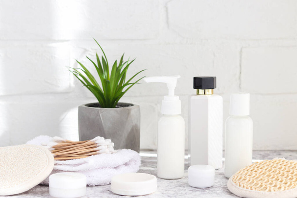 Different eco-friendly bathroom accessories and cosmetics. Various moisturizers, ear sticks, facial sponges, and soaps. Zero waste concept - Zdjęcie, obraz