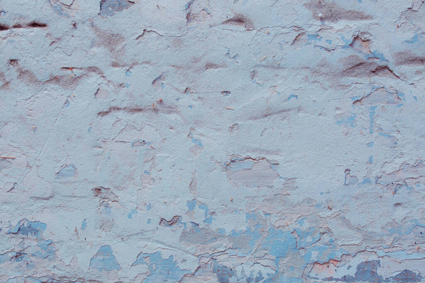 текстура старой гранж стены с трещинами и царапинами, которые могут быть использованы в качестве фона - Фото, изображение