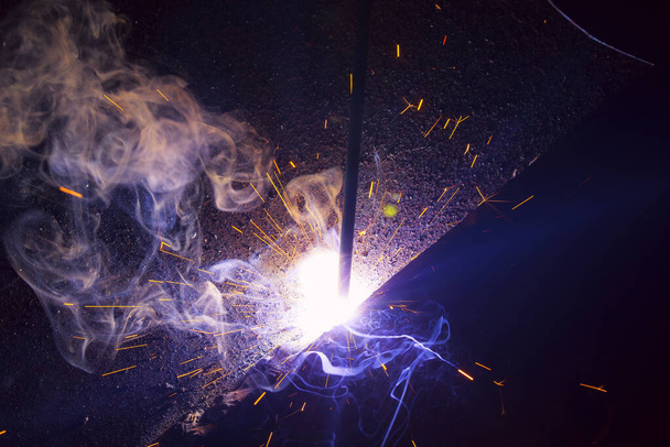 sparks of welding metal with smoke - Photo, Image