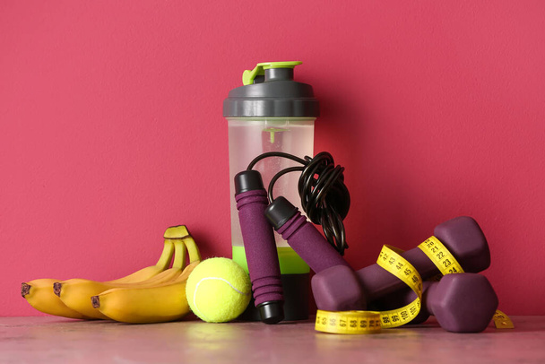 Stylish sport equipment on pink background - Photo, Image