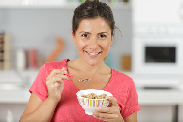 a happy healthy woman having breakfast - Foto, Imagen