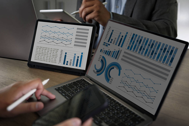 Two Businessman data analysis profit on the computer screen analyzing data marketing planning finance sales data - Φωτογραφία, εικόνα