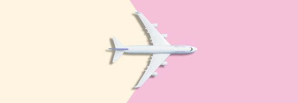 Airplane model. White plane on background. Travel vacation concept. Summer background. Flat lay, top view, copy space. - Photo, Image
