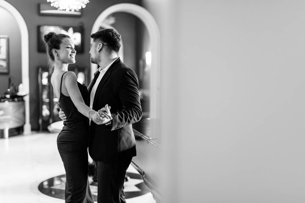 elegant couple indoor black and white - Фото, изображение