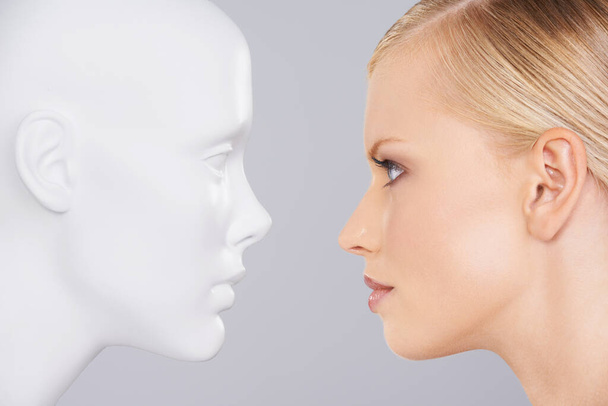Face your problems. Close up of a woman looking at a dummy. - 写真・画像