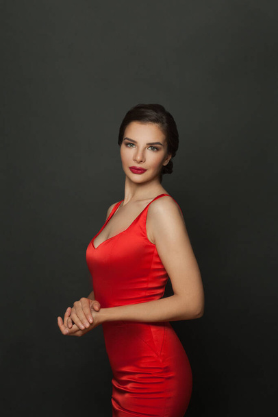 Fashionable beautiful woman in a red dress - Foto, Imagen