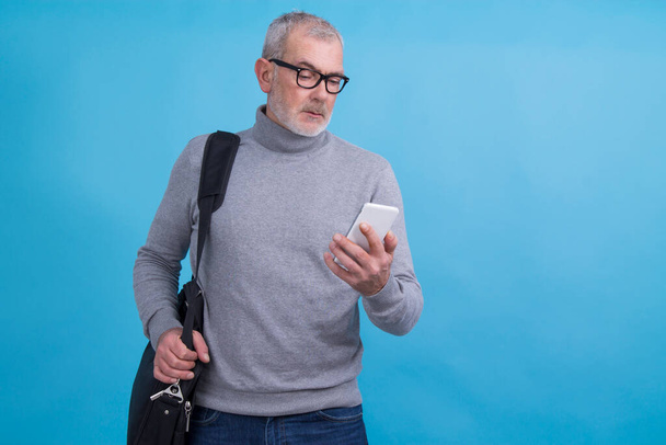 adult man with mobile phone and laptop bag - Photo, Image