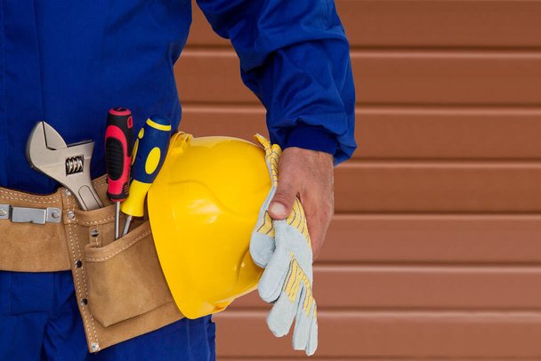 builder with tool belt, renovations, repairs and DIY - Fotoğraf, Görsel