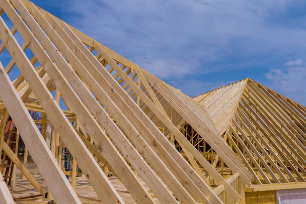 Wooden roof trusses to a timber frame house under construction - Photo, Image
