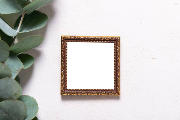 Antique brass Photo Frame Decorated with Green Leaves - Zdjęcie, obraz