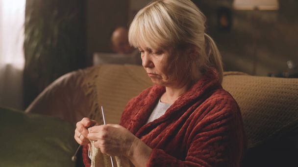 Grandmother knitting a warm sweater - Zdjęcie, obraz