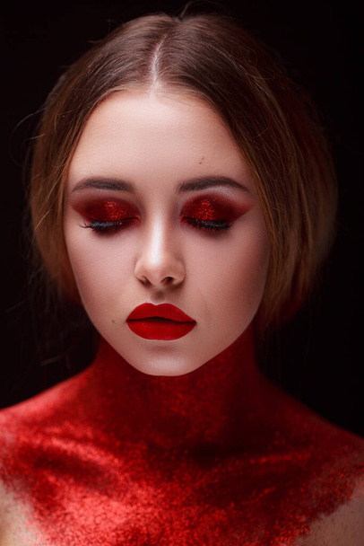 Makeup in the style of beauty. Bright lips and eyes. Portrait of a beautiful young girl. Journal detailed skin retouching. Expressive eyebrows. Huge eyelashes. Neon shadows. - Zdjęcie, obraz
