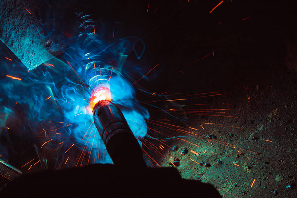 welding metal with sparks and smoke  - Fotó, kép