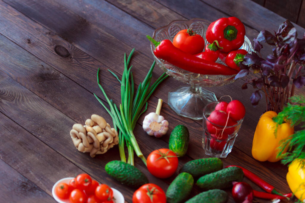Healthy diet. Fresh vegetables on wooden table - 写真・画像