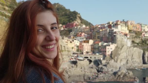 Young girl looks at the landscape in Manarola, city of the Five Lands - Footage, Video