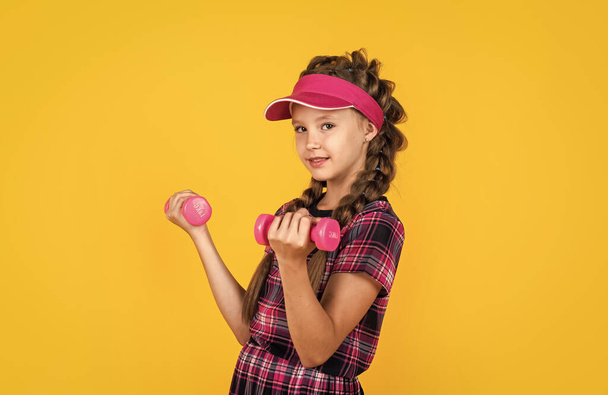 healthy sporty tween girl hold barbells, workout - Photo, Image