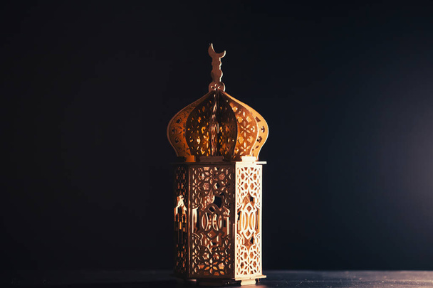 Ramadan Kareem background. Ornamental Arabic lantern glowing at night - Foto, Imagen