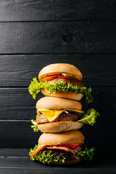 Food, burger on a black background, burger background  - Foto, imagen
