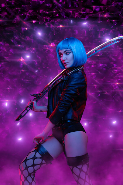Sexy cyberpunk woman with sword posing against violet background - Foto, imagen