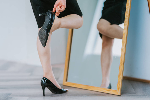 Asian woman putting on high heels to get ready for work - Photo, Image