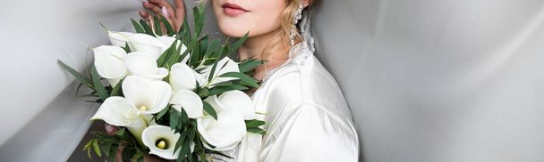 Young attractive bride with flowers - Fotó, kép