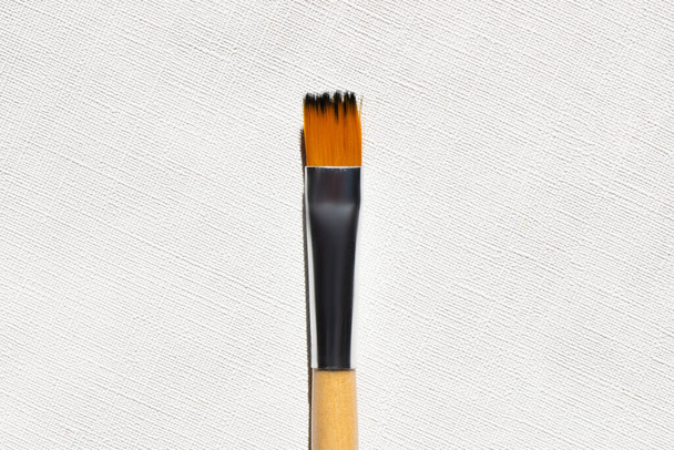 top view of paintbrush on textured background  - Foto, imagen