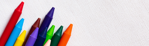 top view of set with colorful crayons on textured white background, banner - Photo, Image