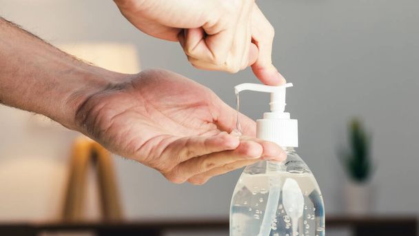 Close up of hand presses sanitizing gel - Φωτογραφία, εικόνα