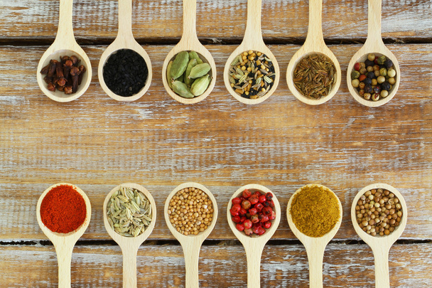 Selection of Indian spices on wooden spoons - Photo, Image
