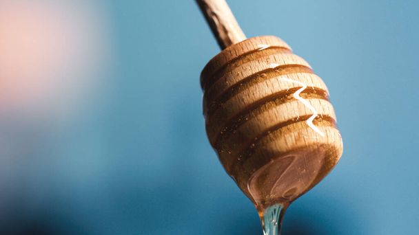 Close up of Dripping Spoon Of Honey - Fotó, kép