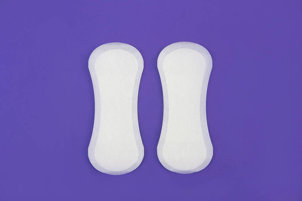 women's white hygienic daily pads on a purple background very peri - Photo, Image