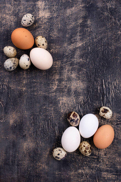 Chicken and quail eggs with blooming branch - Photo, Image