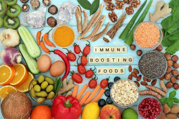 Immune system boosting food for a healthy life. Seafood, dairy, vegetables, cereals, fruit, medicinal herbs, spice. Foods high in antioxidants, smart carbs, fibre, lycopene, protein, vitamins, minerals.  - Photo, Image