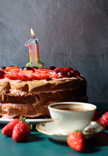 Colorful still life with Birthday cake and retro styled tableware. Strawberry cake on a table.  - 写真・画像