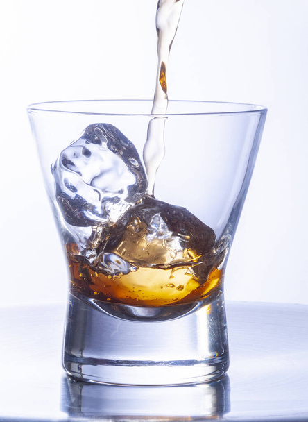 whiskey glasses with ice cubes on steel table - Zdjęcie, obraz