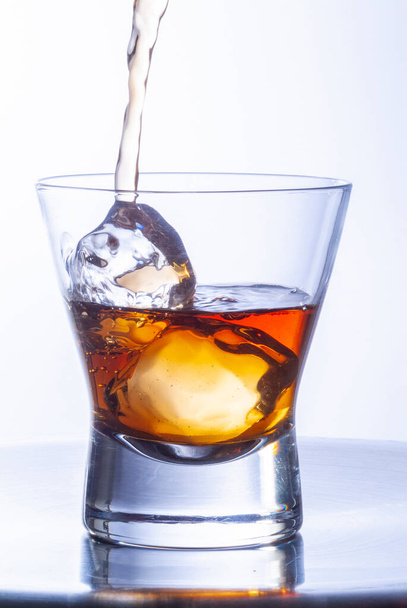 whiskey glasses with ice cubes on steel table - Photo, Image