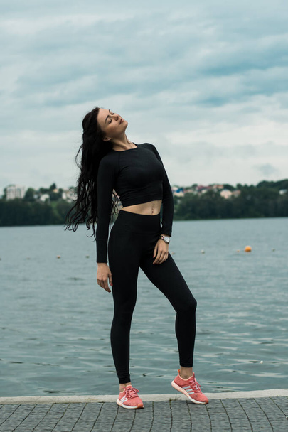 Sexy girl jogging by the lake - 写真・画像