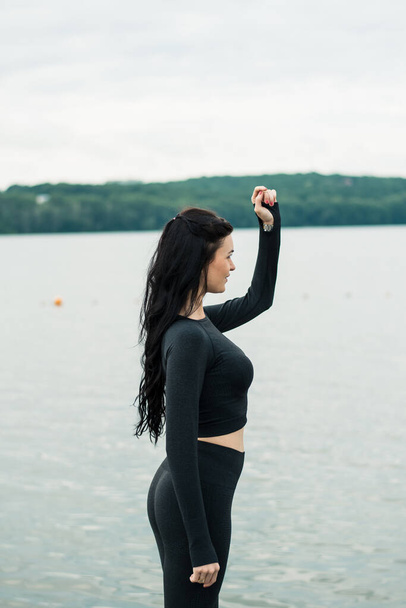 Sexy girl jogging by the lake - Photo, Image