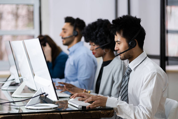 Positive Customer Services Agent With Headset Working In A Call Center - Photo, Image