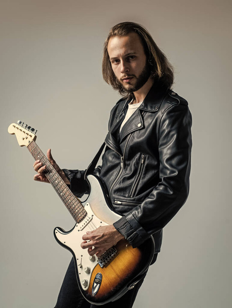 man long hair play electric guitar. rock music style. musician guitar player. - Photo, image