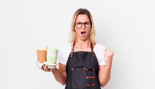 blonde pretty woman shouting aggressively with an angry expression. take away coffee concept - Fotoğraf, Görsel