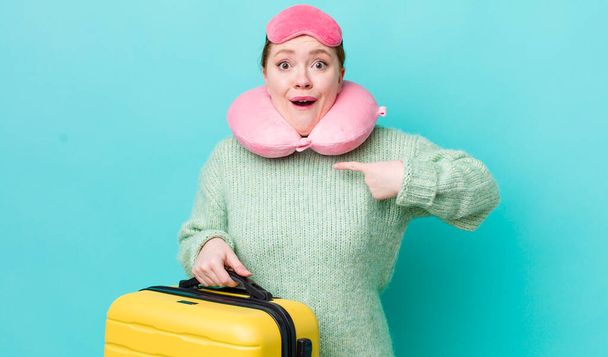 red head pretty woman feeling happy and pointing to self with an excited. flight passenger concept - 写真・画像